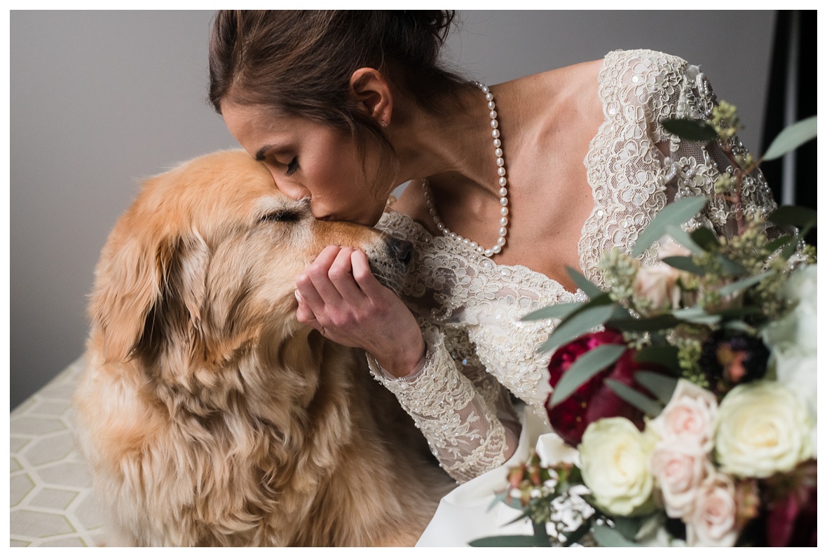 Chattanooga photographer who loves animals with bride kissing dog