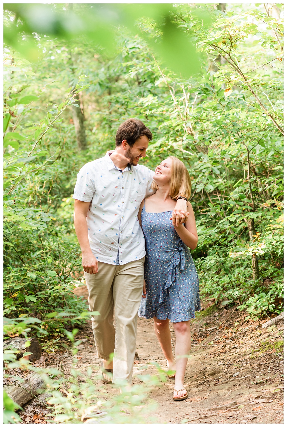 Engaged Couple walking through forest on signal mountain