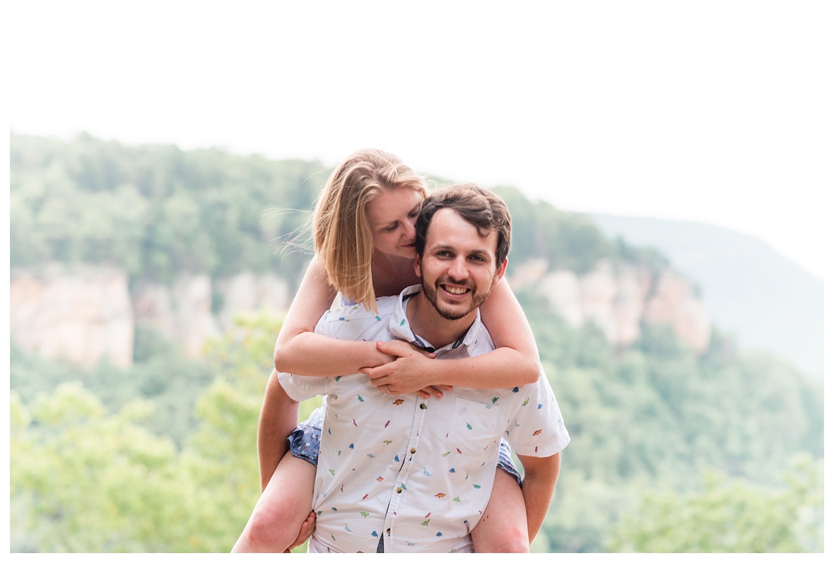 piggy back ride at engagement photo session