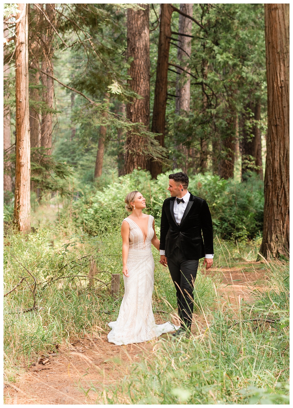 bride and groom walking through woods in Yosemite forrest