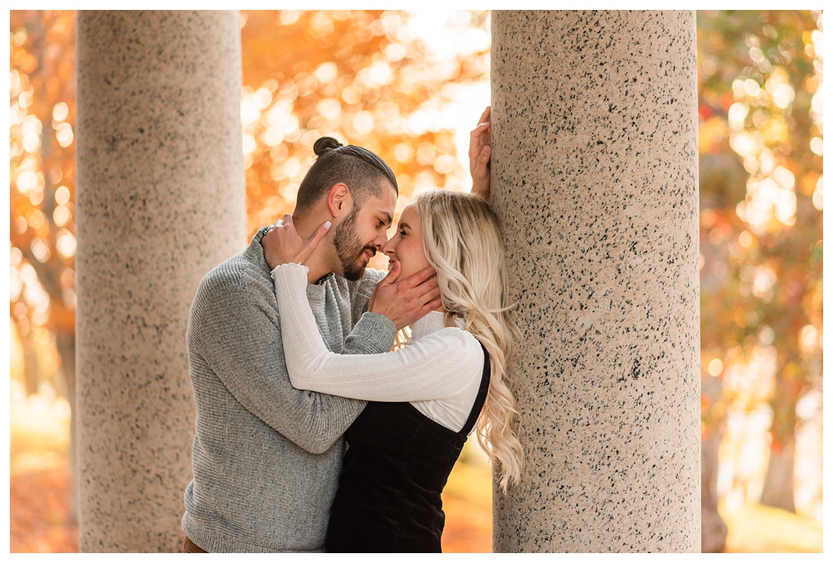 couple snuggles and laughs for engagement photos