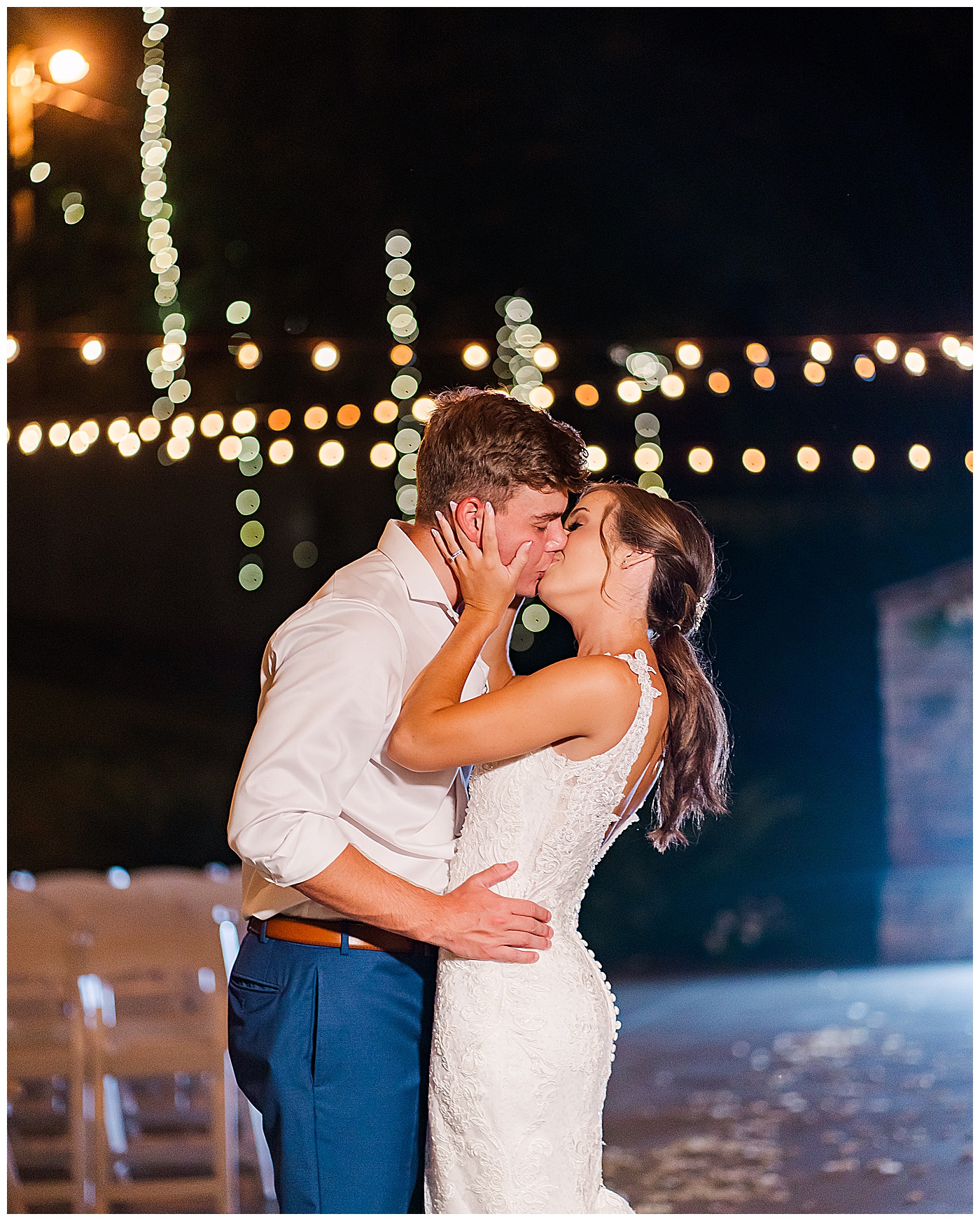 Bride and Groom Kissing outside at night