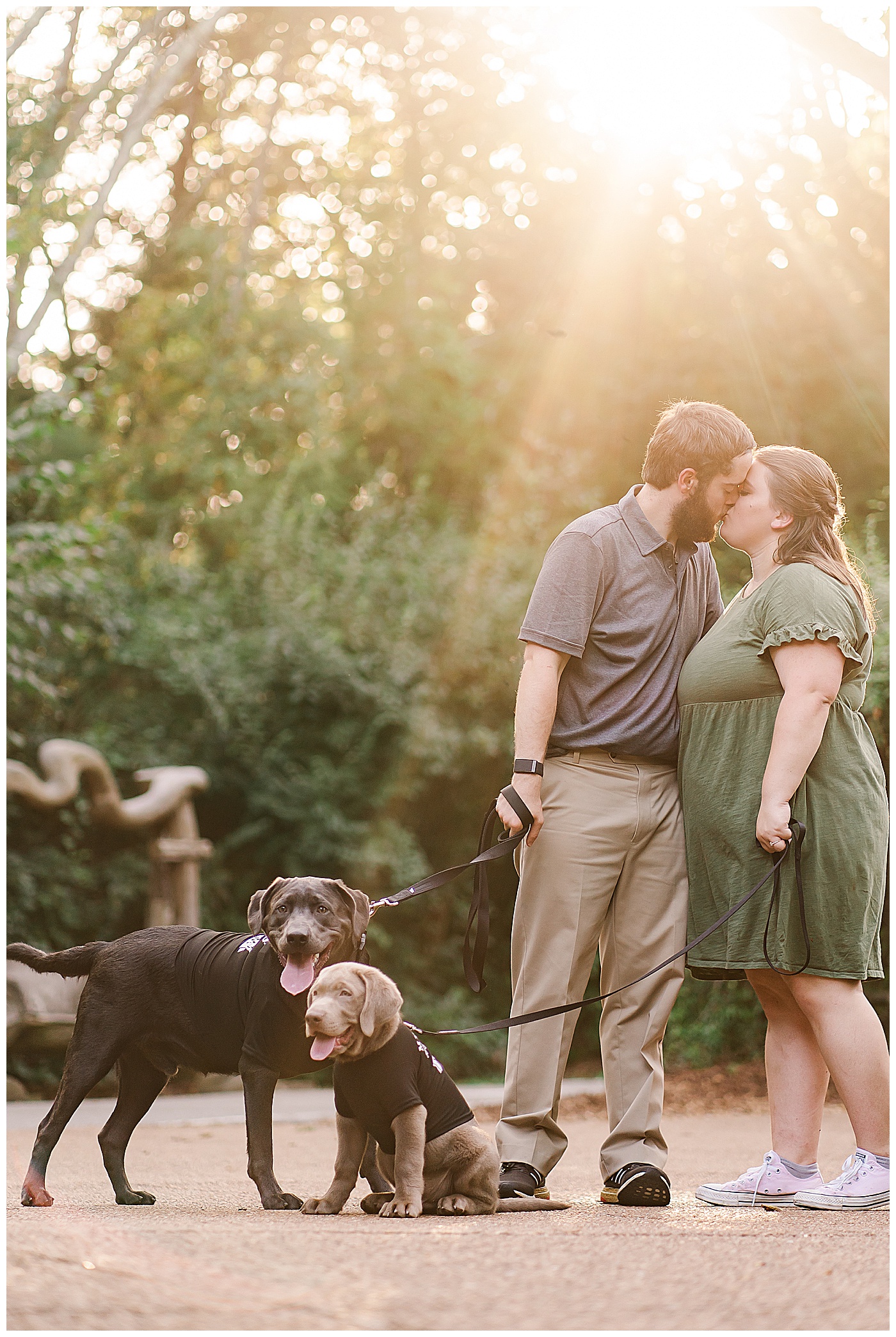 Couple Kissing with Puppies