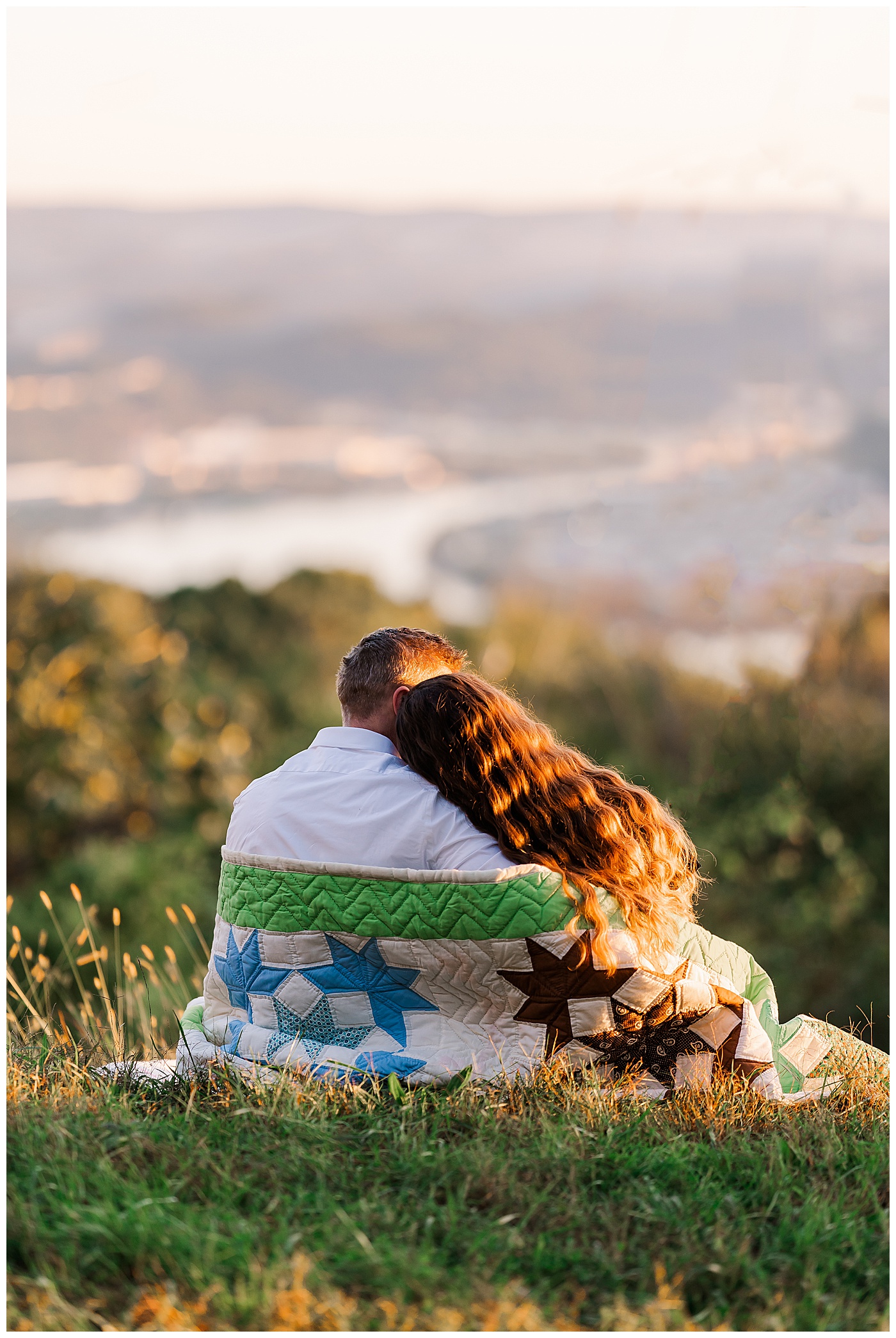 Sunrise Engagement Couple Wrapped in Quilt looking at the view