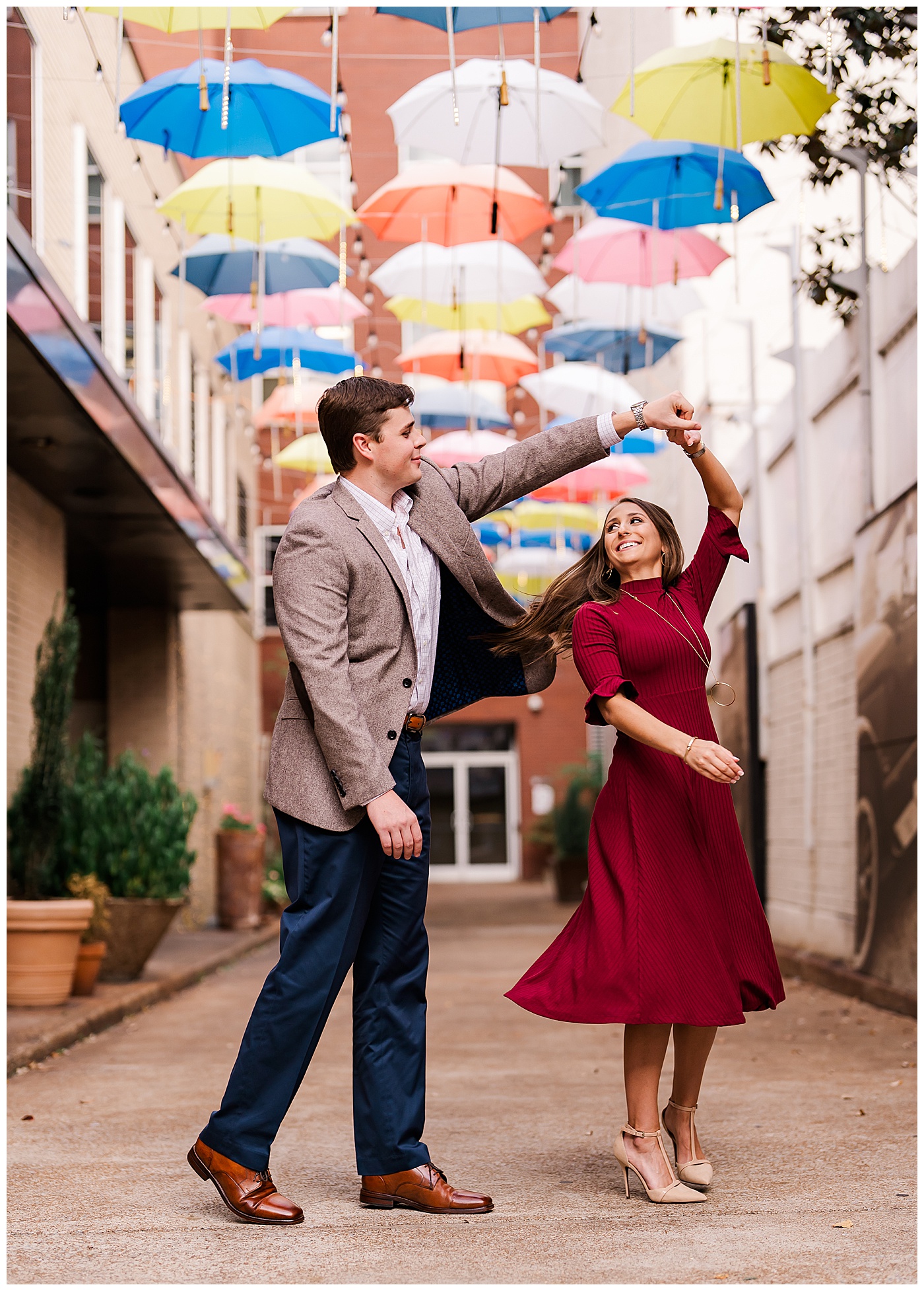 Downtown Chattanooga Engagement Dancing Couple Umbrella Alley