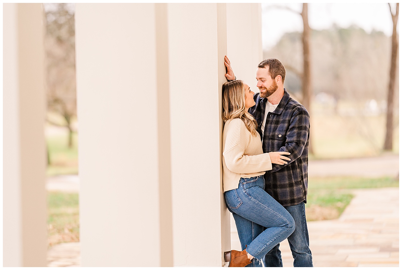 Couple Session in front of house smiling