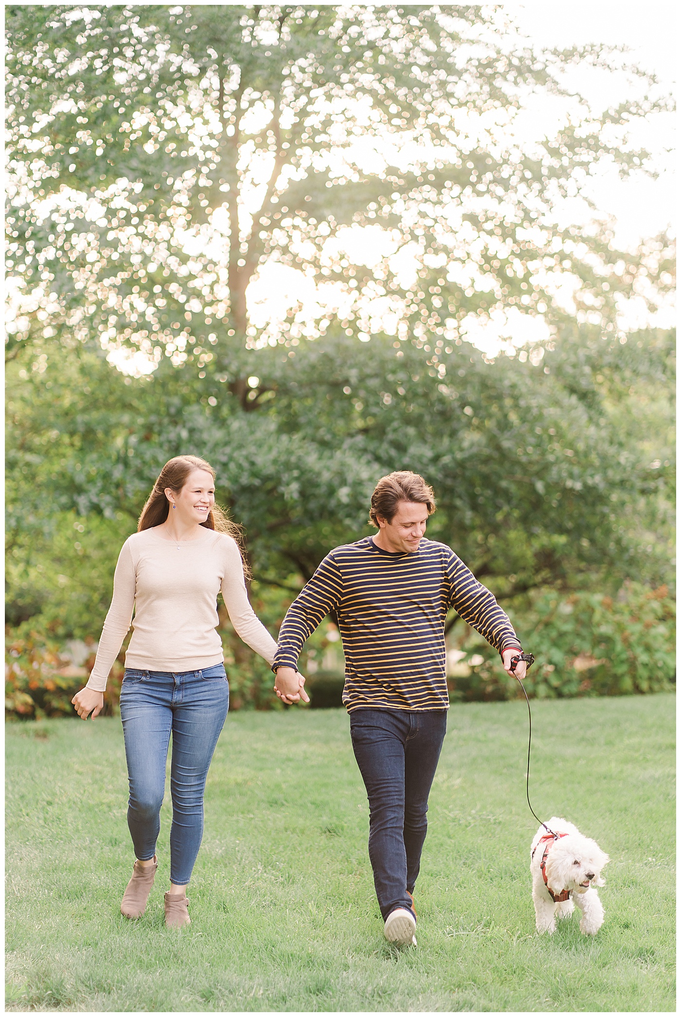 Engaged Couple with Dog Hand in Hand